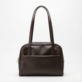 Brown leather handbag on a white background