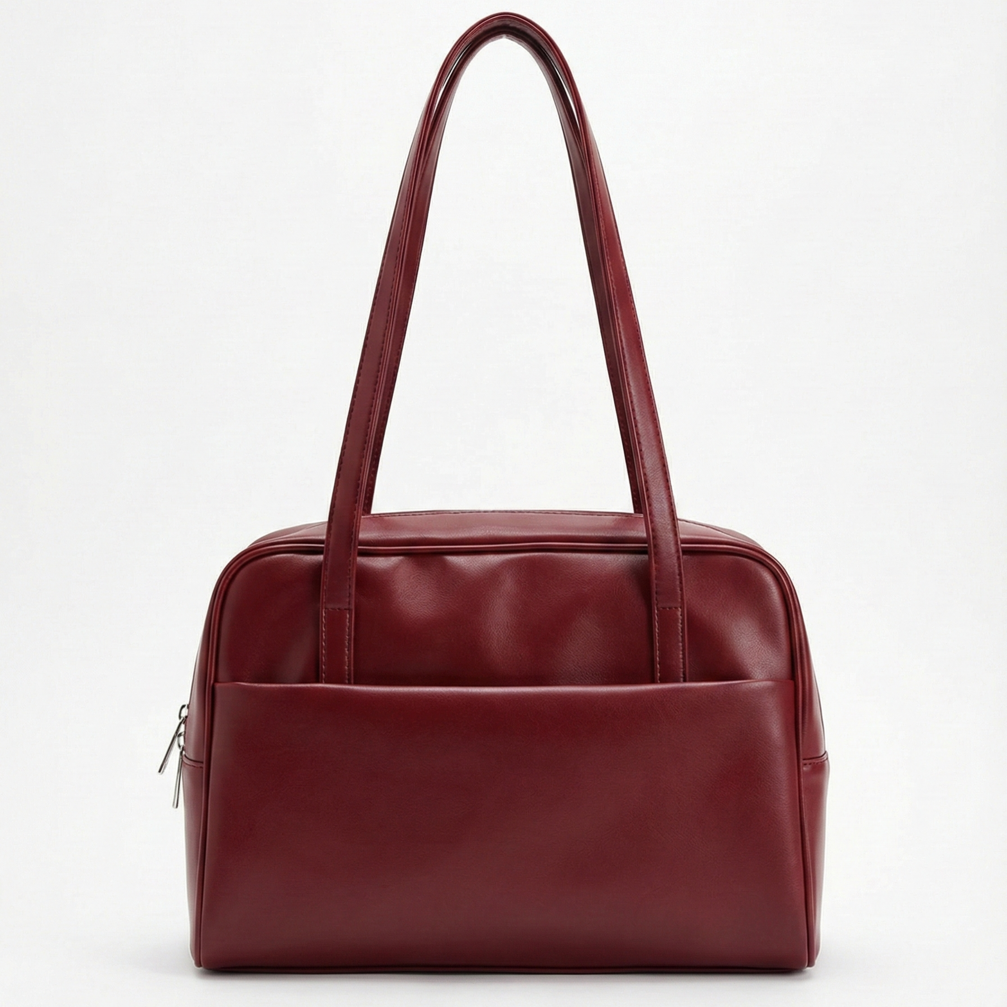 Red leather handbag on a white background